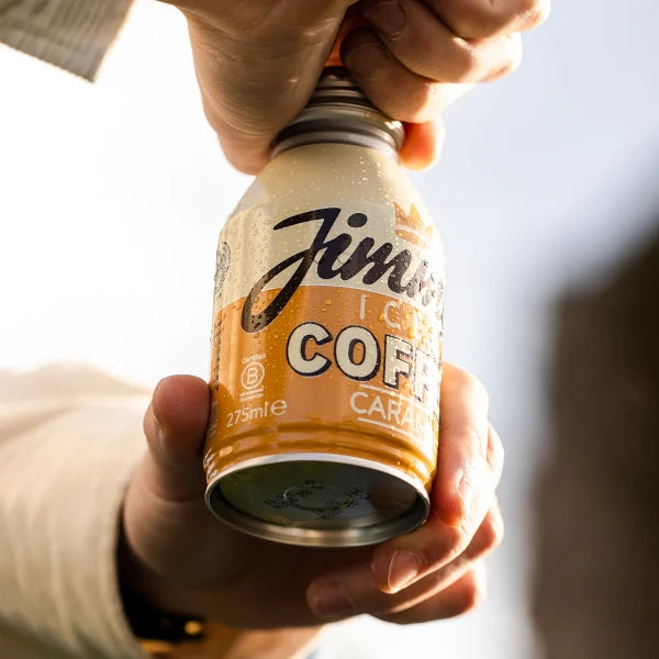 Hand holding a can of Jimmy's Iced Coffee Caramel BottleCan 275ml