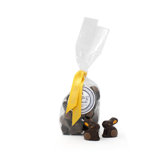 Exquisite bag of luxury dark chocolate praline bunnies, perfect for Easter gifting, elegantly packaged with a festive ribbon, showcasing premium quality and artisan craftsmanship, ideal for chocolate connoisseurs, from the best chocolate shop in London.