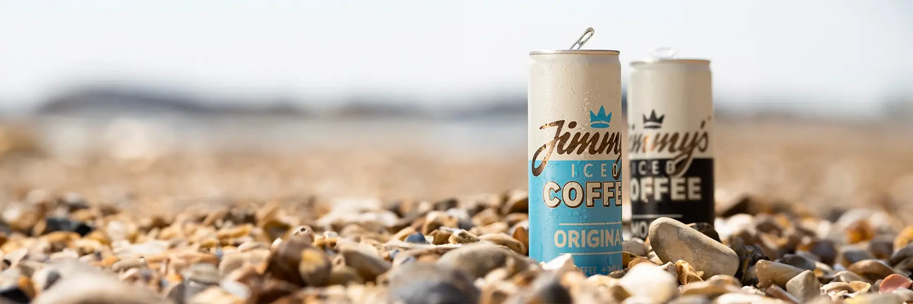 Jimmy's Iced Coffee 2 cans on the beach