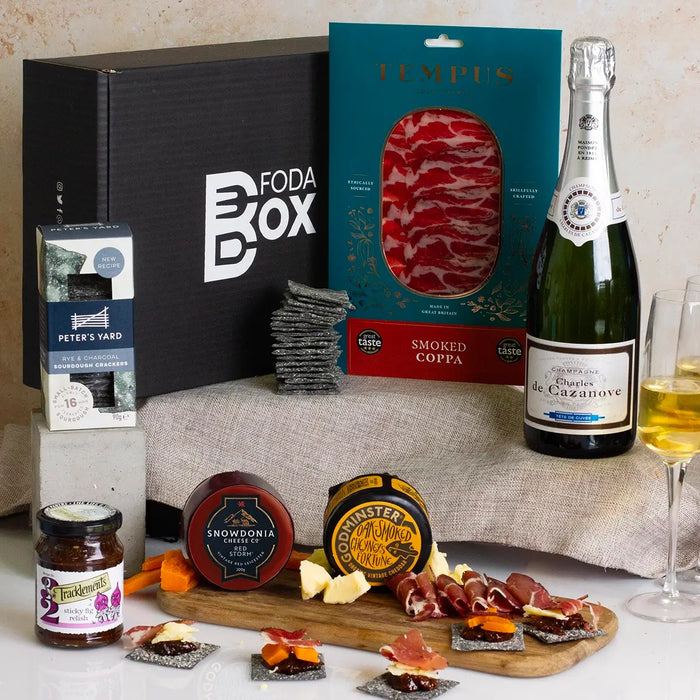 Luxury Celebration Hamper champagne cheese and charcuterie spread with crackers and chutney