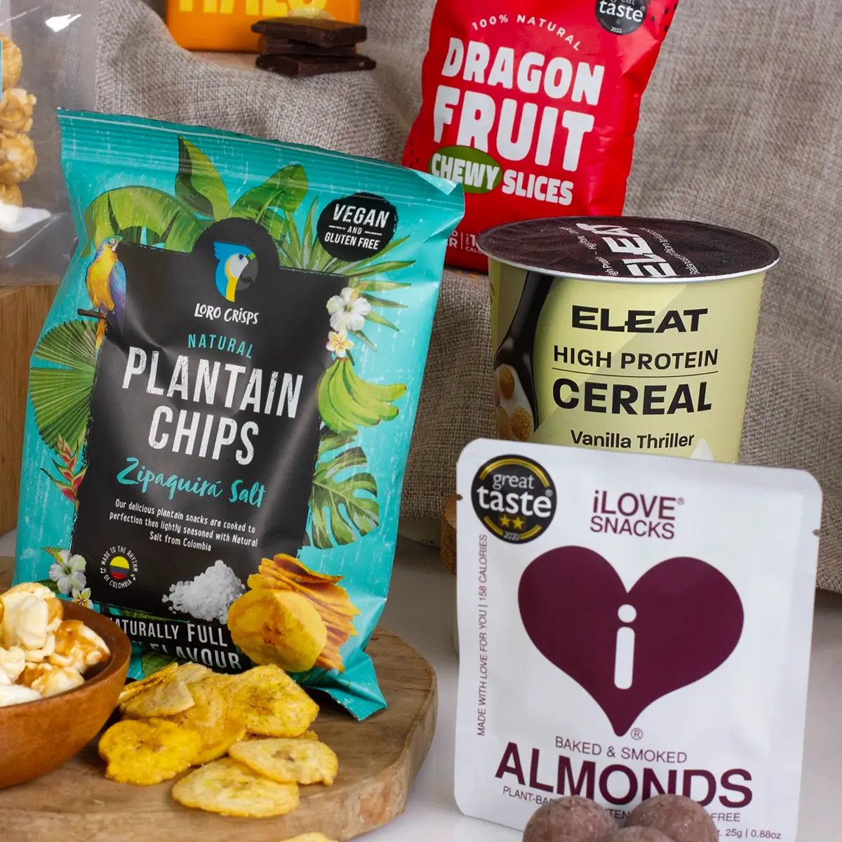 Loro plantain chips, Eleat cereal and Ilove snacks smoked almonds close up