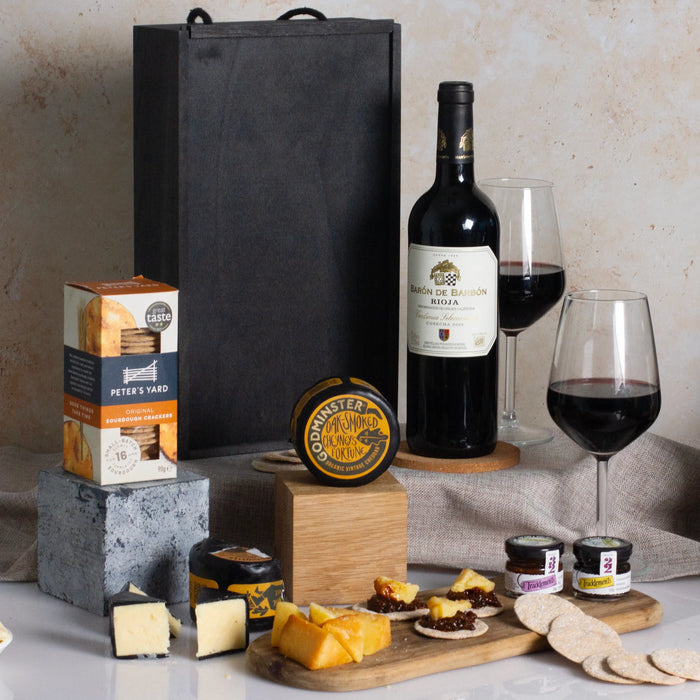 red wine, cheese, crackers and spread