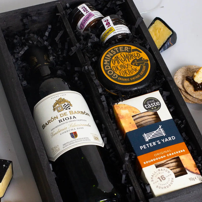 Red wine in wooden box close up