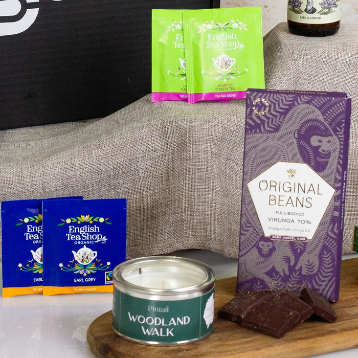 Chocolate bar, Teabags and candle close up