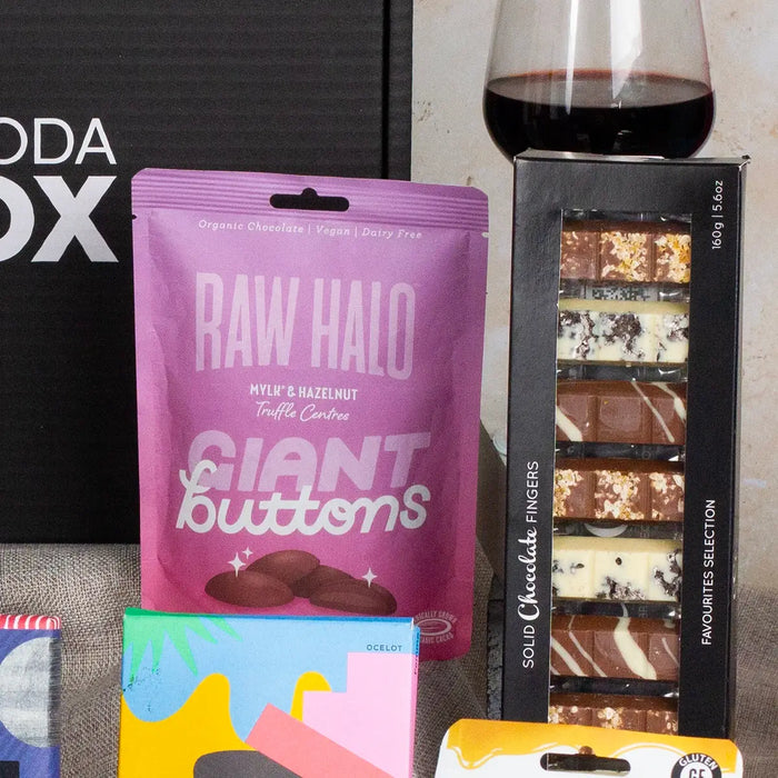 Chocolate button and fingers close up