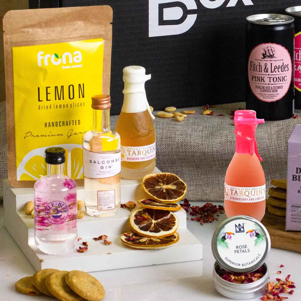 Craft pink gin hamper, miniature gins and lemon slices.