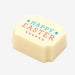 A white chocolate filled with dark chocolate ganache, made by Harry Specters, with a Happy Easter message printed on the top.