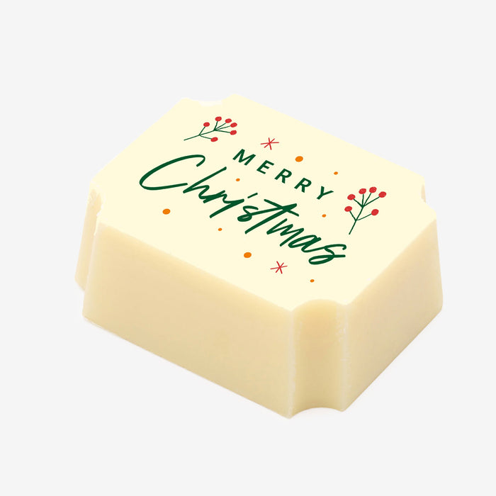 A white chocolate filled with dark chocolate ganache, made by Harry Specters, with a Merry Christmas message printed on the top.