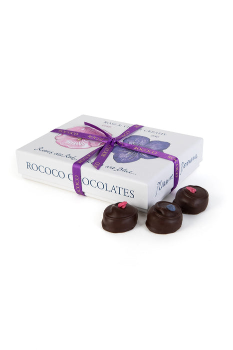 Rococo Chocolates Rose and Violet Creams. Handmade floral creams enrobed in dark chocolate, perfect for gifting. Gift wrapped chocolates, with a signature Rococo Ribbon. Available online and for collection in-store.