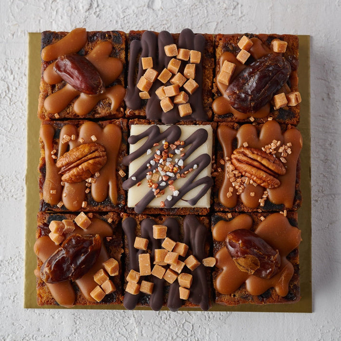 caramel and date cake topped with caramel, walnuts, belgian chocolate and fudge pieces 