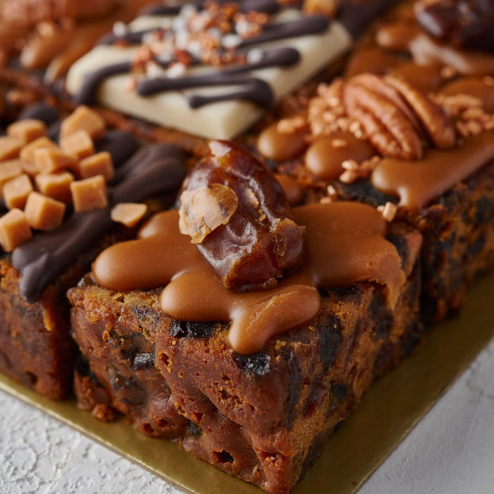 a close up photo of a salted caramel and date cake