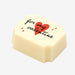 A white chocolate filled with dark chocolate ganache, made by Harry Specters, with a Valentine's Day message printed on the top.