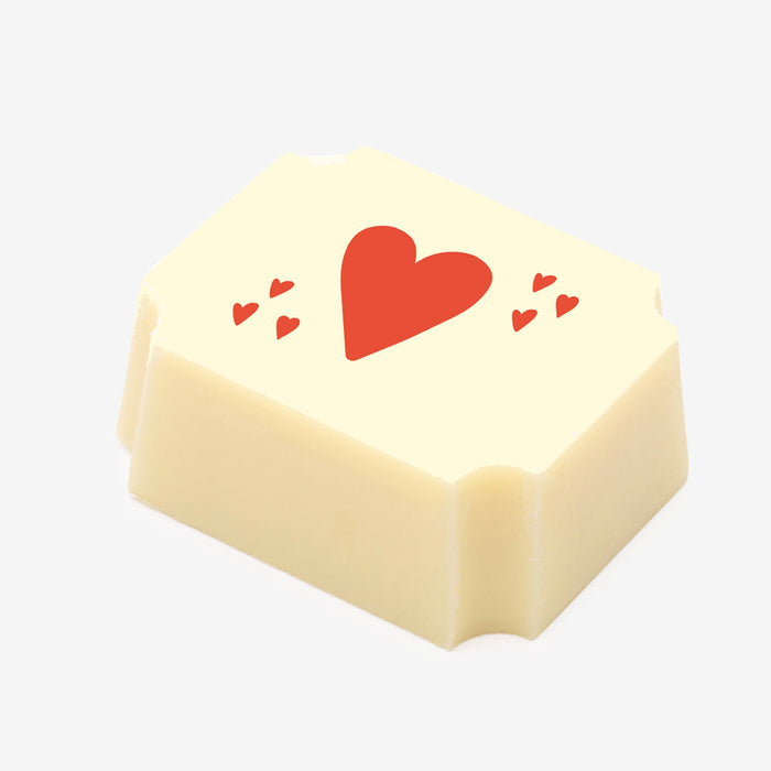 A white chocolate filled with dark chocolate ganache, made by Harry Specters, with a Valentine's Day heart printed on the top.